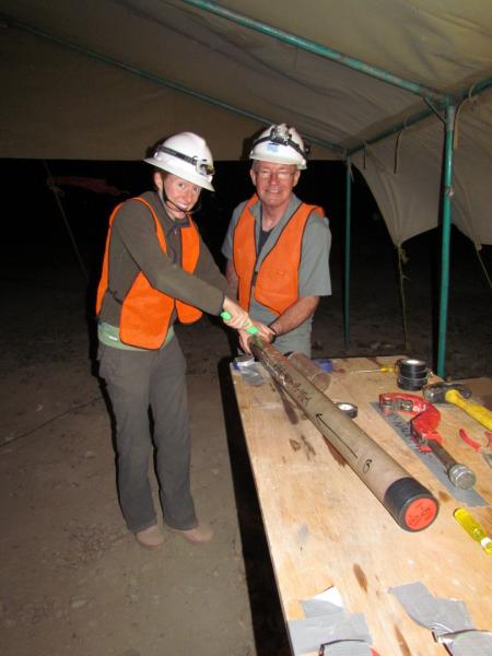 Cat Beck and David Feary cutting and marking core at Osi Isi